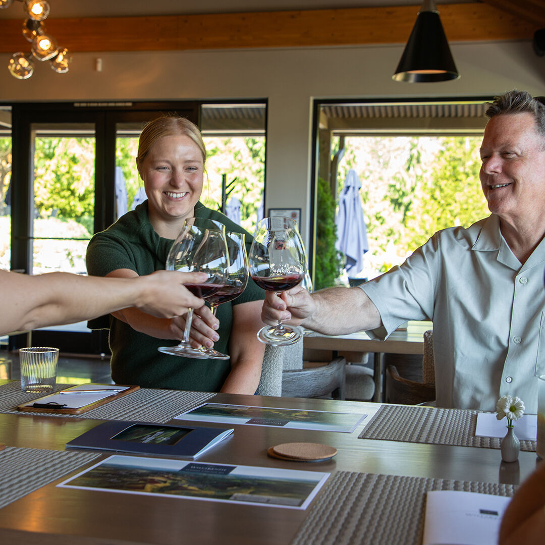 Group enjoying Estate Tasting in WillaKenzie Estate tasting room.